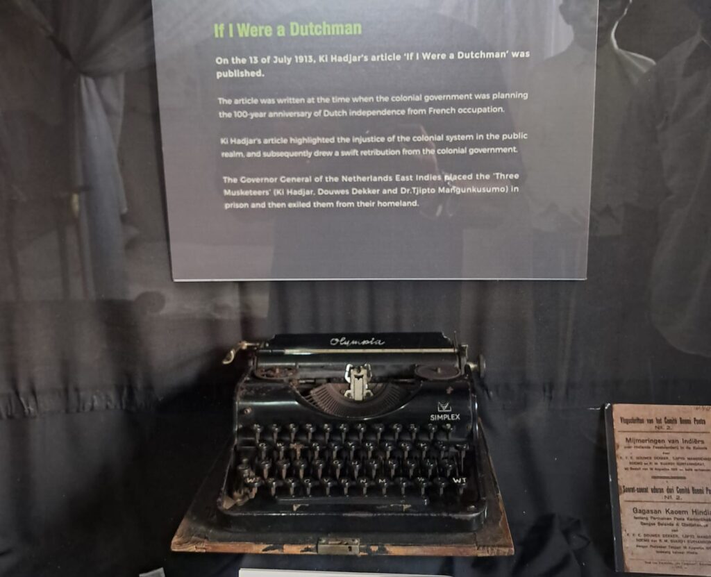 Img20260430wa0021 catrawarta Display case with an antique olympiasimplex typewriter on a wooden base a text panel above explains'If I Were a Dutchman'
