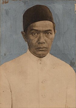 Historic portrait of a man wearing a white traditional tunic and a dark fez-like hat, looking straight ahead with a neutral expression.