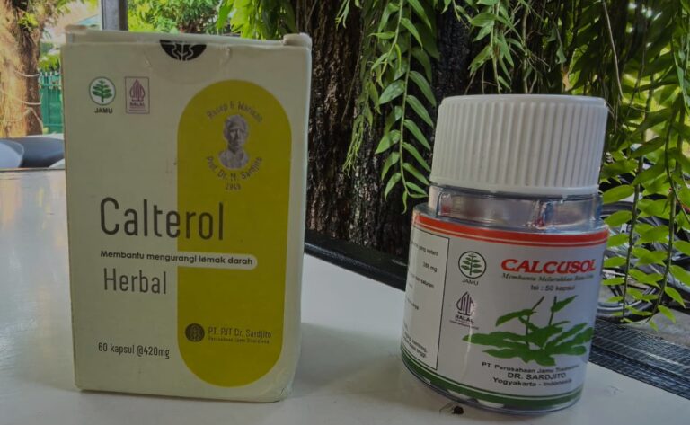 Boxes of herbal supplements (Calterol Herbal) and Calcusol bottle on a table outdoors among greenery, showing labels and logos.