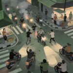 Urban street scene showing multiple motorbikes converging at a busy intersection as smoke rises from one bike while pedestrians and street vendors watch from the sidewalk