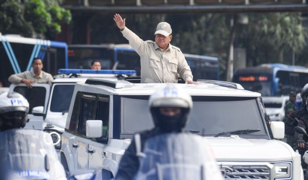 Police officer stands in an open sunroof of a white suv saluting during a convoy   but lets correct syntax