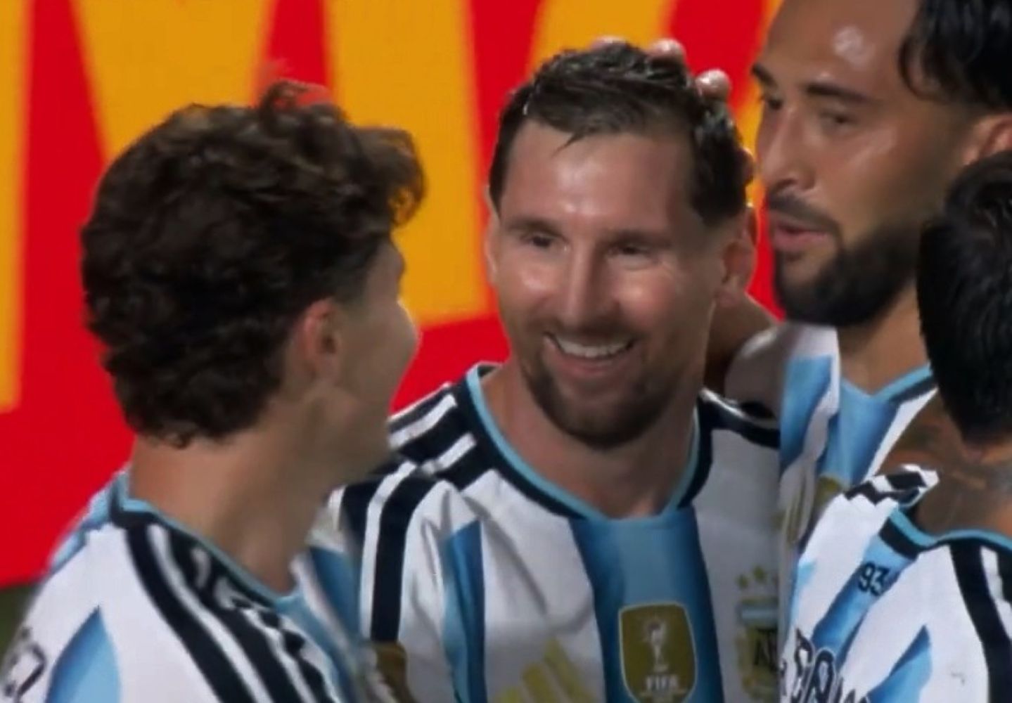 17flionel catrawarta Two soccer players in argentina national team jerseys celebrate together on the field smiles visible amid a group celebration