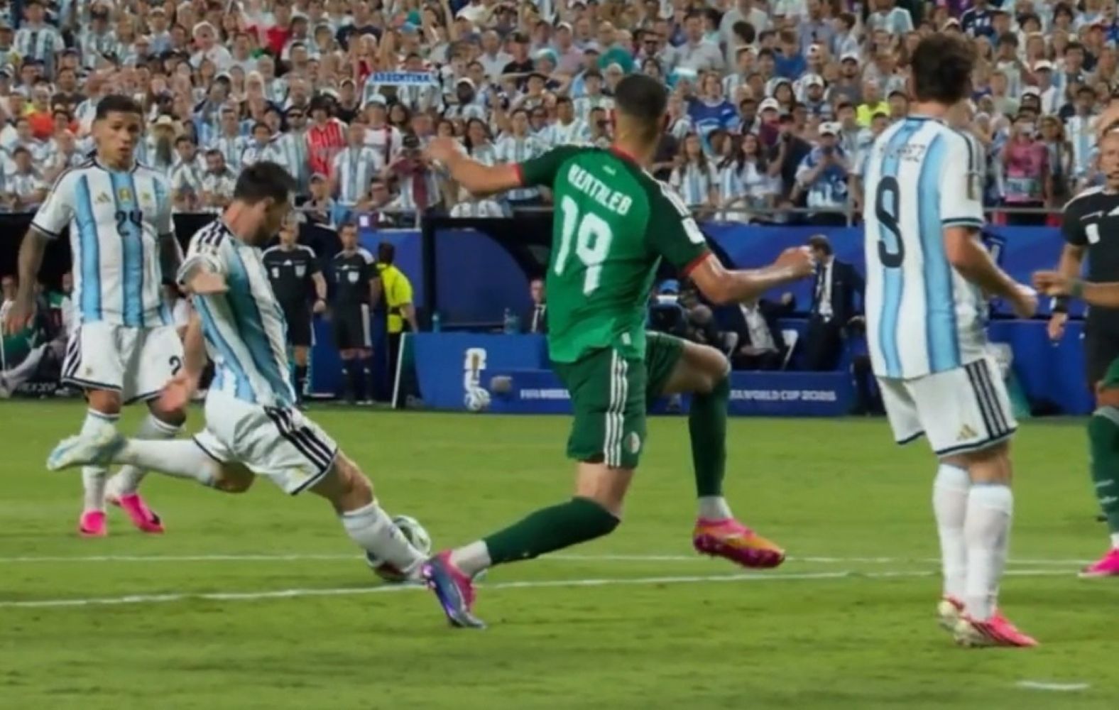 17fmessi catrawarta Soccer players from argentina blue and white stripes and a green clad opponent contest the ball on a crowded field during a match