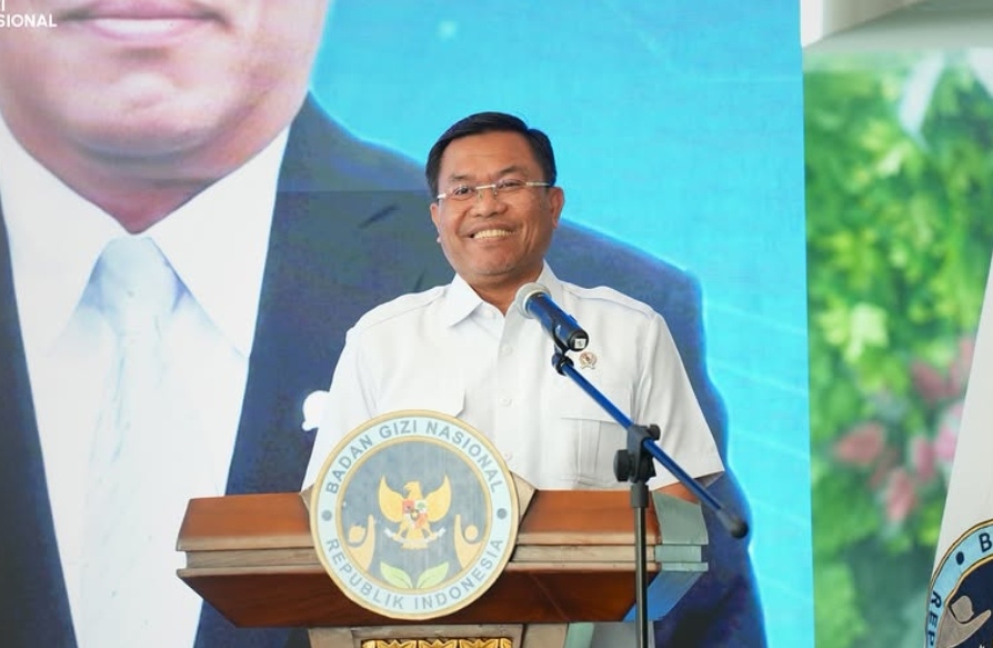 17fsony catrawarta Man delivering a speech at a podium with the indonesian national emblem seal visible on the lectern