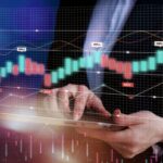 Hands hold a tablet with a glowing stock chart overlay showing greenred candlesticks and buysell markers