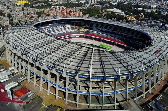 7fstadion catrawarta Aerial view of a large circular stadium with a green field and tiered seating