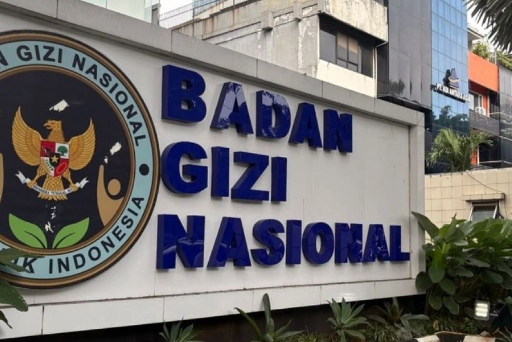 Signboard reading badan gizi nasional with the indonesian eagle emblem on the left national nutrition agency